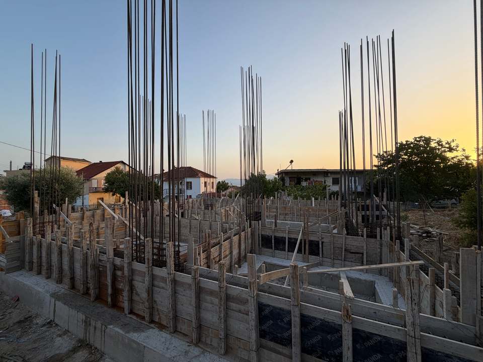 The townhouse under construction, with the foundations and reinforcement in place